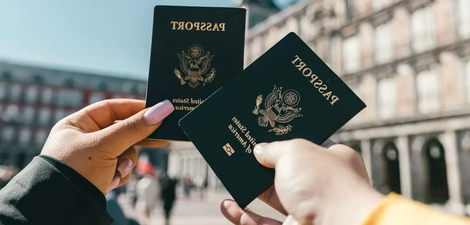 Global Engagement - Two people holding passports 